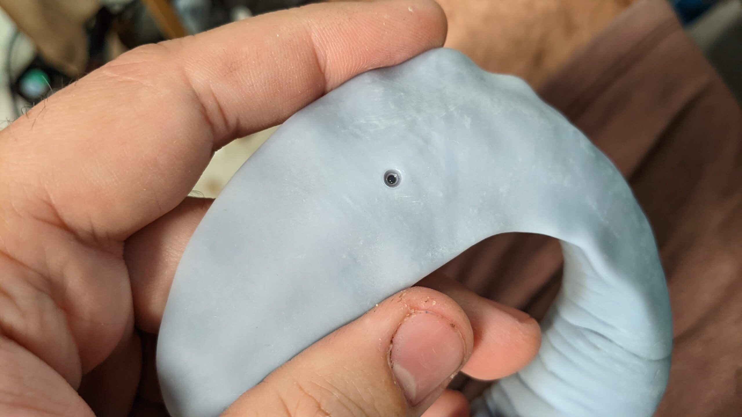 An object 3D printed in resin with a partially filled drainage hole
